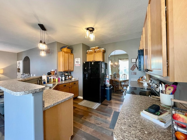 6231 Red Glare Dr Unit 287, Galloway, OH 43119 - kitchen featuring black appliances, arched walkways, a peninsula, a sink, and dark wood-style floors