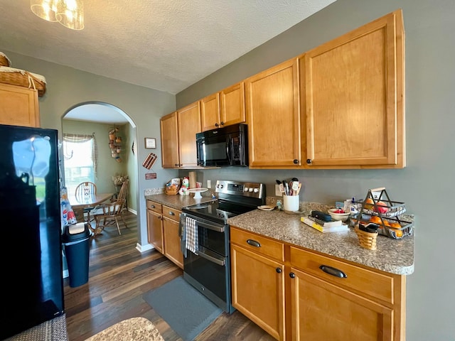6231 Red Glare Dr Unit 287, Galloway, OH 43119 - kitchen featuring black appliances, arched walkways, dark wood-style flooring, a textured ceiling, and baseboards