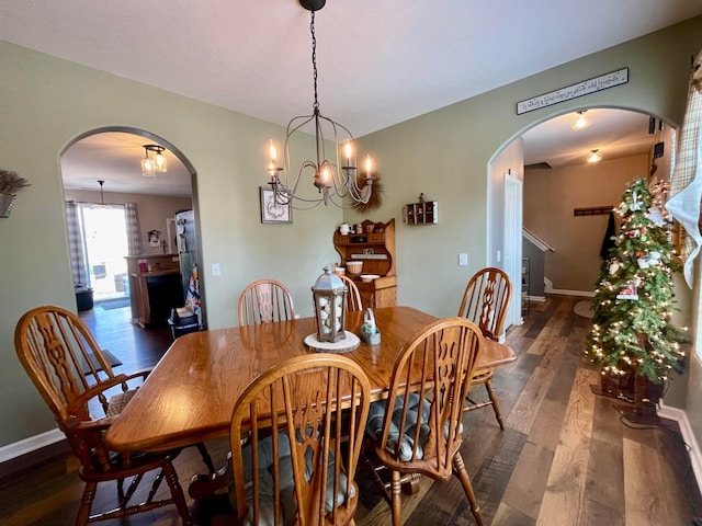 6231 Red Glare Dr Unit 287, Galloway, OH 43119 - dining space featuring arched walkways, wood finished floors, and baseboards