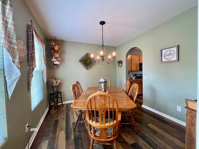 6231 Red Glare Dr Unit 287, Galloway, OH 43119 - dining area featuring arched walkways, plenty of natural light, dark wood-style floors, and baseboards