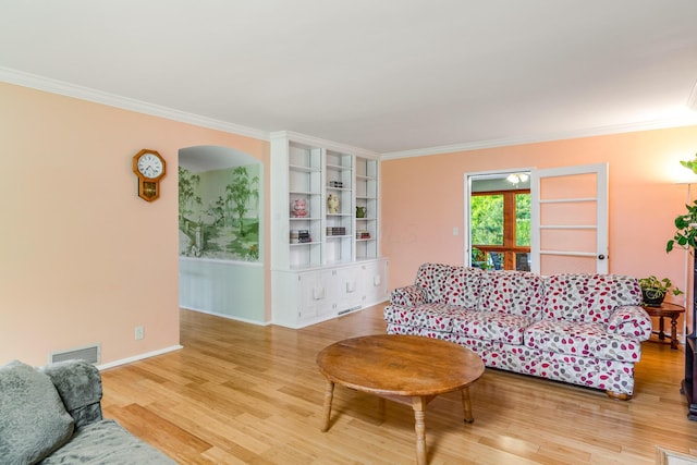 1117 E Vine St, Mount Vernon, OH 43050 - living area with crown molding, light wood finished floors, and baseboards