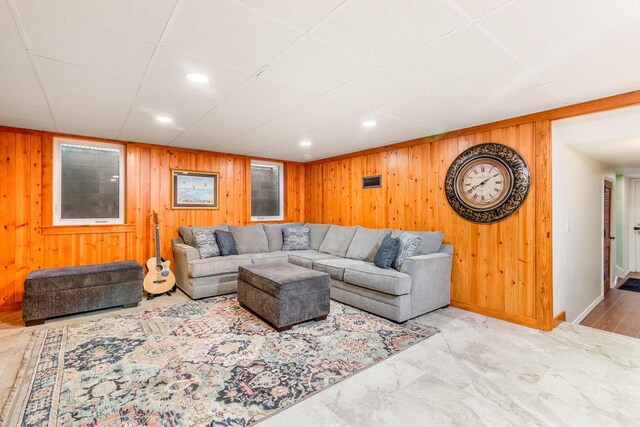 1117 E Vine St, Mount Vernon, OH 43050 - living room featuring wooden walls, baseboards, a drop ceiling, and recessed lighting