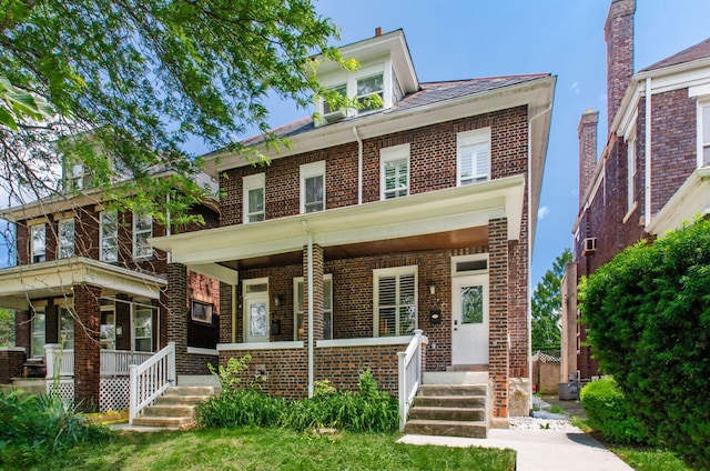 626-628 Wilson Ave, Columbus, OH 43205 - traditional style home featuring a porch and brick siding