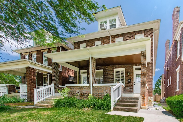 626-628 Wilson Ave, Columbus, OH 43205 - view of front facade featuring a porch and brick siding