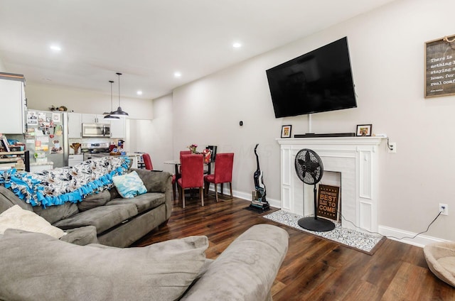 626-628 Wilson Ave, Columbus, OH 43205 - living room with dark wood-style flooring, recessed lighting, baseboards, and a fireplace with flush hearth