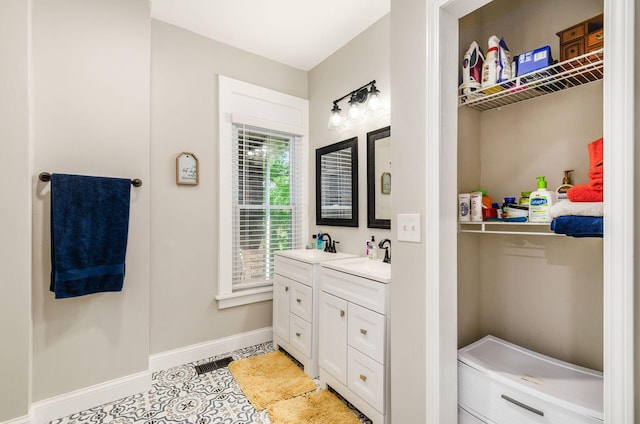 626-628 Wilson Ave, Columbus, OH 43205 - bathroom with vanity, baseboards, and tile patterned flooring