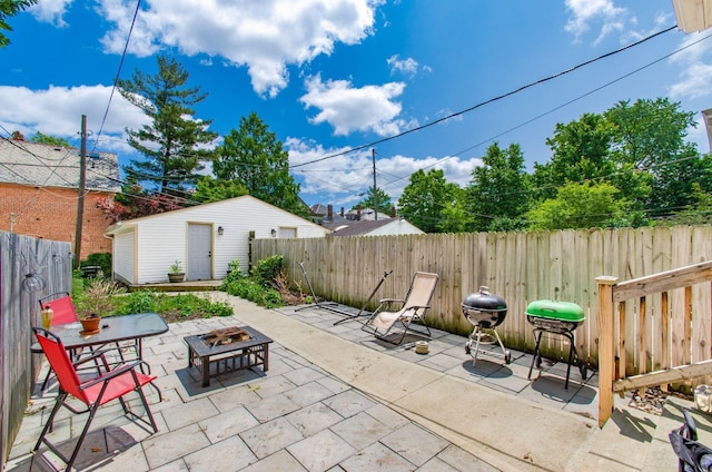 626-628 Wilson Ave, Columbus, OH 43205 - fenced backyard with an outdoor fire pit, a patio, and grilling area
