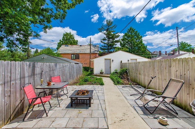 626-628 Wilson Ave, Columbus, OH 43205 - fenced backyard with an outdoor fire pit and a patio