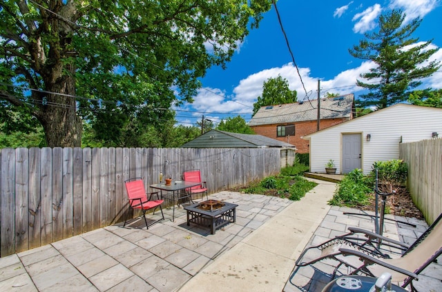 626-628 Wilson Ave, Columbus, OH 43205 - fenced backyard with an outdoor fire pit, a patio, and an outdoor structure
