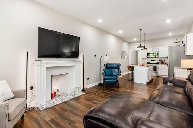626-628 Wilson Ave, Columbus, OH 43205 - living room featuring dark wood finished floors, recessed lighting, baseboards, and a fireplace