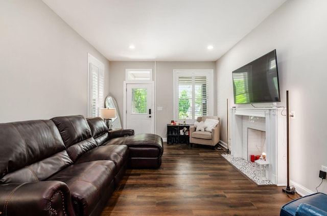 626-628 Wilson Ave, Columbus, OH 43205 - living room with a high end fireplace, dark wood finished floors, recessed lighting, and baseboards