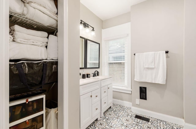 626-628 Wilson Ave, Columbus, OH 43205 - bathroom with baseboards, vanity, and tile patterned floors