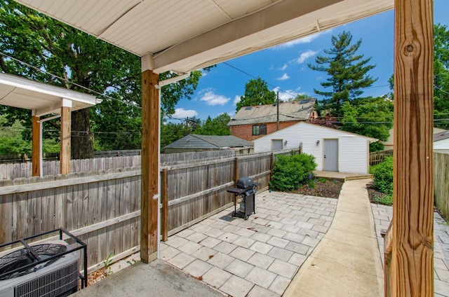 626-628 Wilson Ave, Columbus, OH 43205 - fenced backyard with area for grilling, a patio, and an outdoor structure