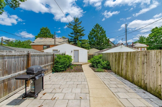 626-628 Wilson Ave, Columbus, OH 43205 - fenced backyard with a patio area, grilling area, and an outdoor structure