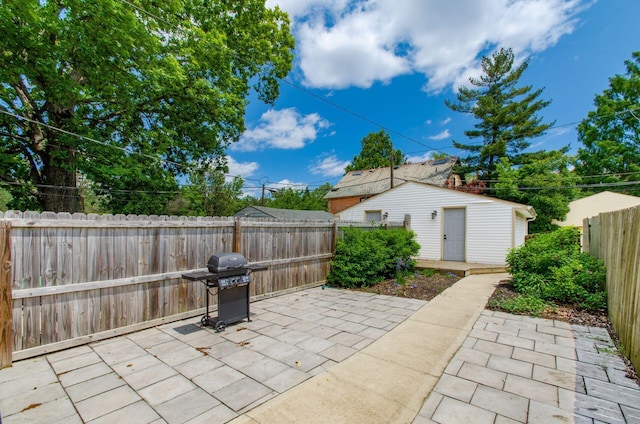 626-628 Wilson Ave, Columbus, OH 43205 - fenced backyard with a patio area, grilling area, and an outdoor structure