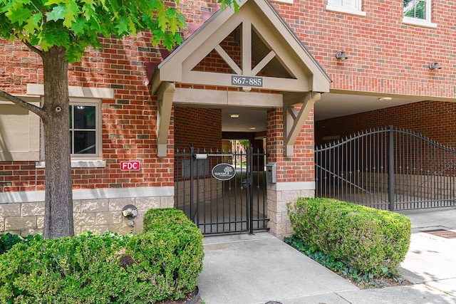 873 S Pearl St, Columbus, OH 43206 - doorway to property with brick siding and a gate