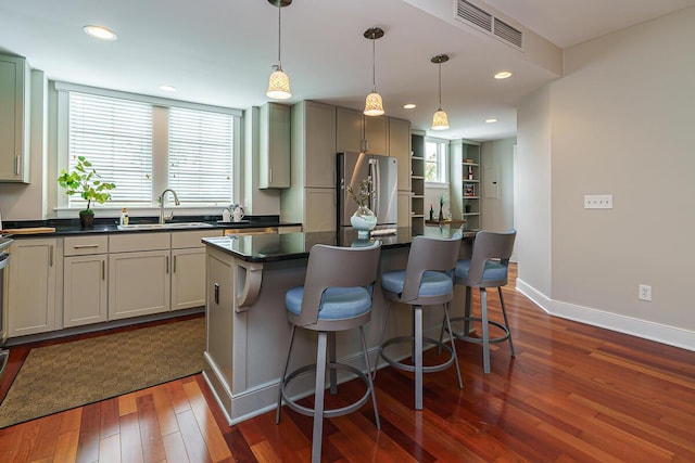 873 S Pearl St, Columbus, OH 43206 - kitchen featuring a sink, dark countertops, freestanding refrigerator, dark wood finished floors, and healthy amount of natural light