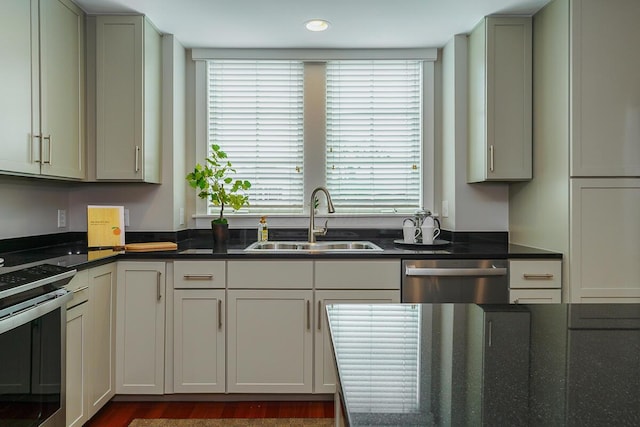873 S Pearl St, Columbus, OH 43206 - kitchen with appliances with stainless steel finishes, a sink, recessed lighting, and dark stone counters