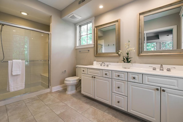 873 S Pearl St, Columbus, OH 43206 - bathroom with double vanity, a stall shower, toilet, and recessed lighting