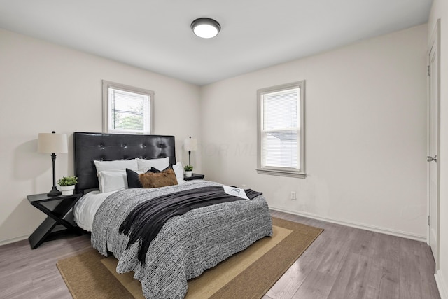 3091 Azelda St, Columbus, OH 43224 - bedroom featuring light wood-style flooring and baseboards