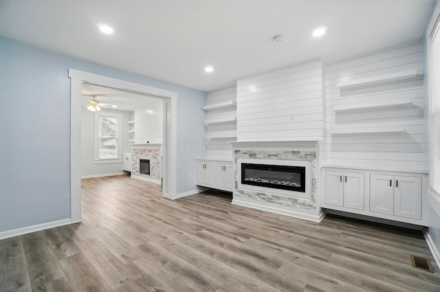 517 S Champion Ave, Columbus, OH 43205 - unfurnished living room featuring a glass covered fireplace, wood finished floors, baseboards, recessed lighting, and a ceiling fan