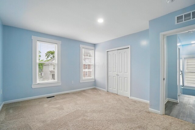 517 S Champion Ave, Columbus, OH 43205 - unfurnished bedroom with carpet floors, baseboards, and a closet