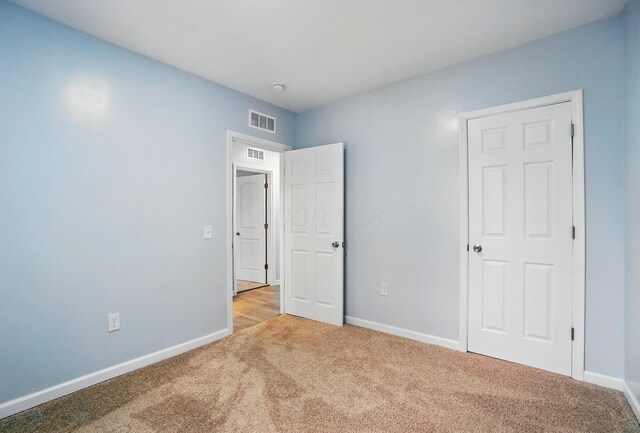 517 S Champion Ave, Columbus, OH 43205 - unfurnished bedroom with carpet floors and baseboards