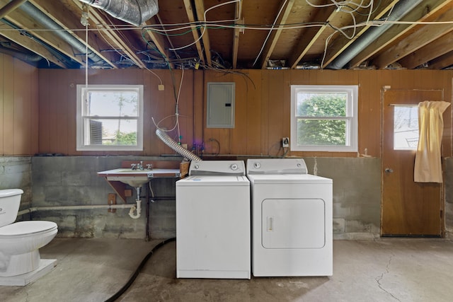 4930 Carbondale Dr, Columbus, OH 43232 - laundry area with washing machine and dryer, electric panel, and plenty of natural light