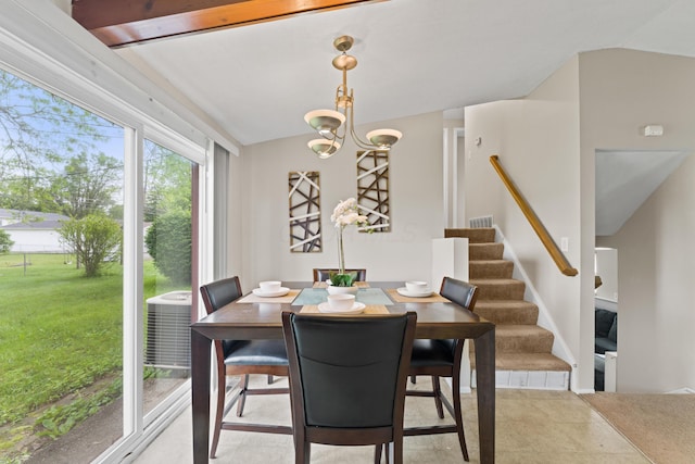 4930 Carbondale Dr, Columbus, OH 43232 - dining space with stairs and a chandelier