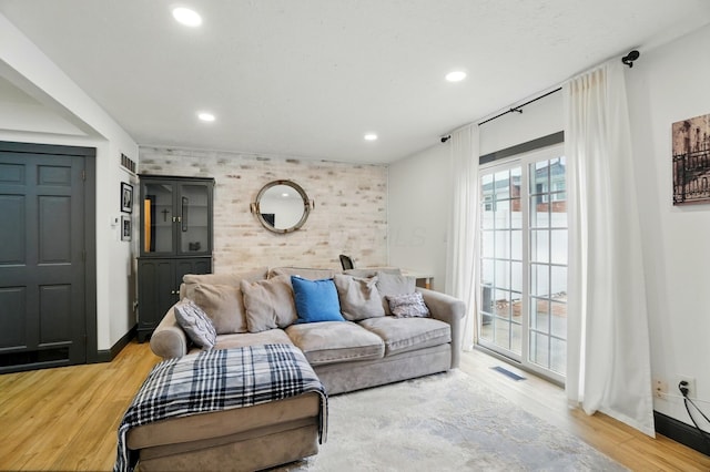 538 S Otterbein Ave Unit 2E, Westerville, OH 43081 - living area featuring an accent wall, wood finished floors, recessed lighting, and baseboards