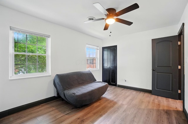 538 S Otterbein Ave Unit 2E, Westerville, OH 43081 - living area with light wood-style floors, baseboards, and a ceiling fan