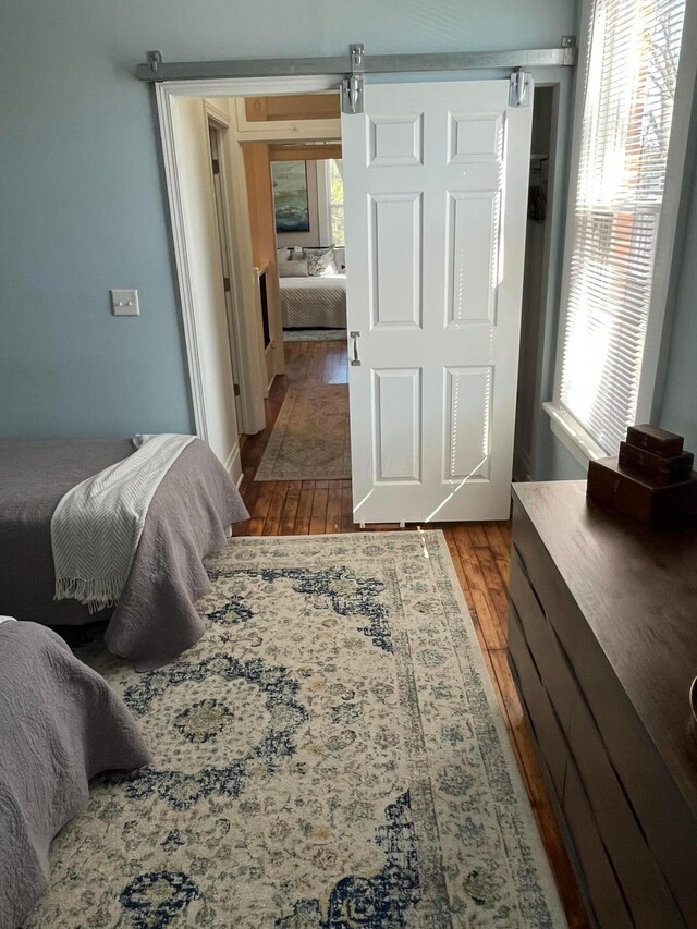323 E Kossuth St, Columbus, OH 43206 - bedroom with wood-type flooring and multiple windows