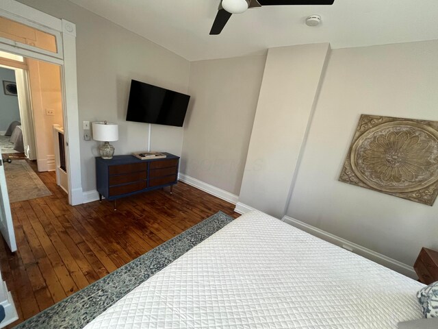 323 E Kossuth St, Columbus, OH 43206 - bedroom featuring wood-type flooring, baseboards, and ceiling fan