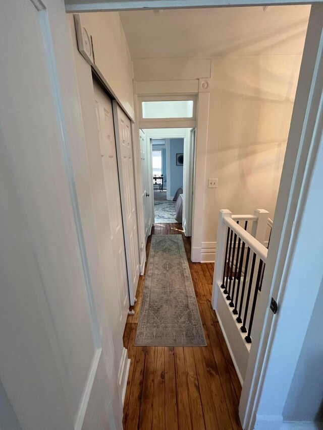 323 E Kossuth St, Columbus, OH 43206 - corridor featuring dark wood-type flooring and an upstairs landing