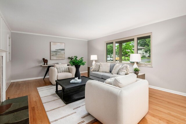 2105 Chardon Rd, Columbus, OH 43220 - living area featuring light wood-style flooring, ornamental molding, and baseboards