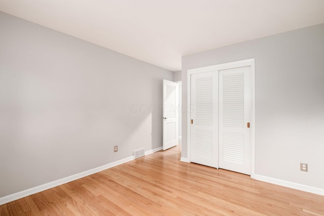 2105 Chardon Rd, Columbus, OH 43220 - unfurnished bedroom with light wood-style floors, baseboards, and a closet