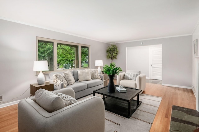 2105 Chardon Rd, Columbus, OH 43220 - living area featuring light wood-style floors, crown molding, and baseboards