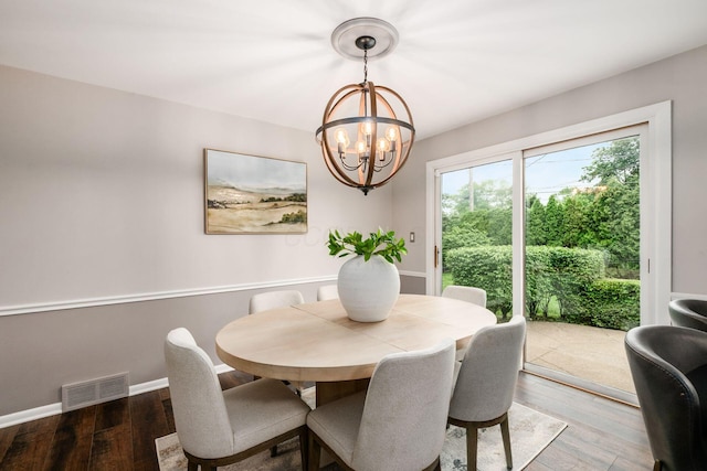 2105 Chardon Rd, Columbus, OH 43220 - dining area featuring a chandelier, wood finished floors, and baseboards