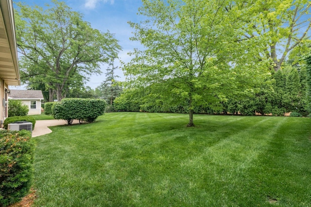 2105 Chardon Rd, Columbus, OH 43220 - view of grassy yard featuring cooling unit