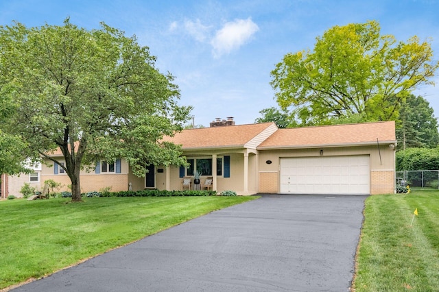 2105 Chardon Rd, Columbus, OH 43220 - ranch-style home with an attached garage, driveway, a chimney, and brick siding