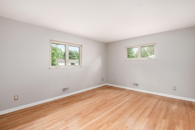 2105 Chardon Rd, Columbus, OH 43220 - spare room with plenty of natural light, baseboards, and wood finished floors