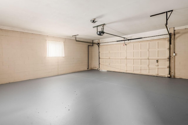 2105 Chardon Rd, Columbus, OH 43220 - garage featuring concrete block wall and a garage door opener