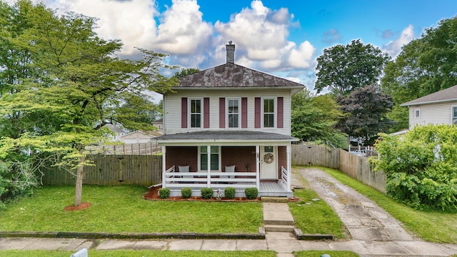 216 N St, Utica, OH 43080 - american foursquare style home featuring driveway, a chimney, and a porch