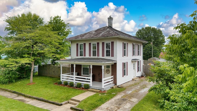 216 N St, Utica, OH 43080 - view of front of home with covered porch, a chimney, dirt driveway, and metal roof