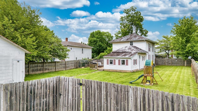 216 N St, Utica, OH 43080 - rear view of house featuring a playground and metal roof