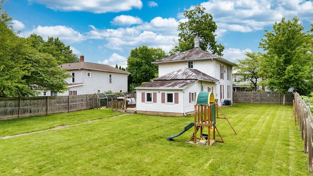 216 N St, Utica, OH 43080 - rear view of house featuring cooling unit, a playground, and a chimney