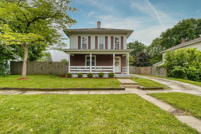 216 N St, Utica, OH 43080 - american foursquare style home featuring driveway, a chimney, and a porch