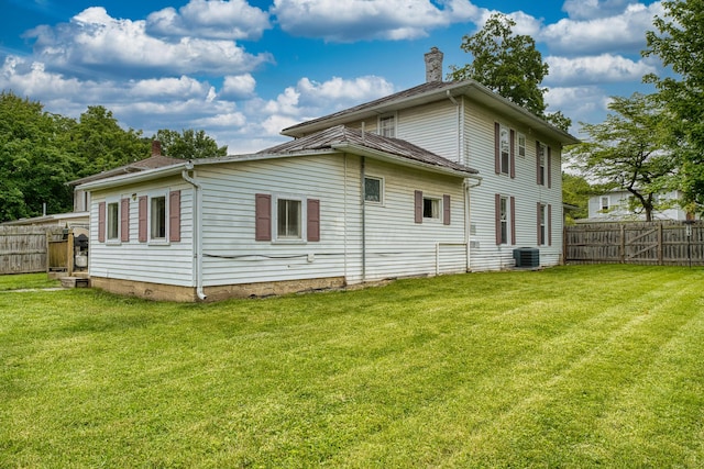 216 N St, Utica, OH 43080 - rear view of house featuring a chimney and central AC