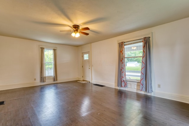 216 N St, Utica, OH 43080 - unfurnished room with ceiling fan, healthy amount of natural light, and dark wood finished floors