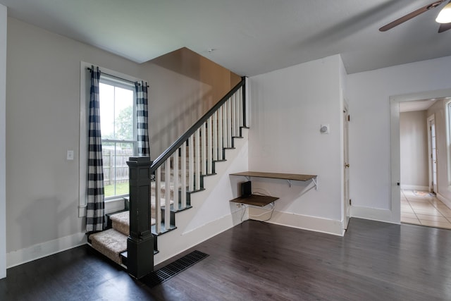 216 N St, Utica, OH 43080 - stairway featuring wood finished floors, ceiling fan, and baseboards